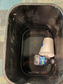 Bucket with garbage catching the dripping water