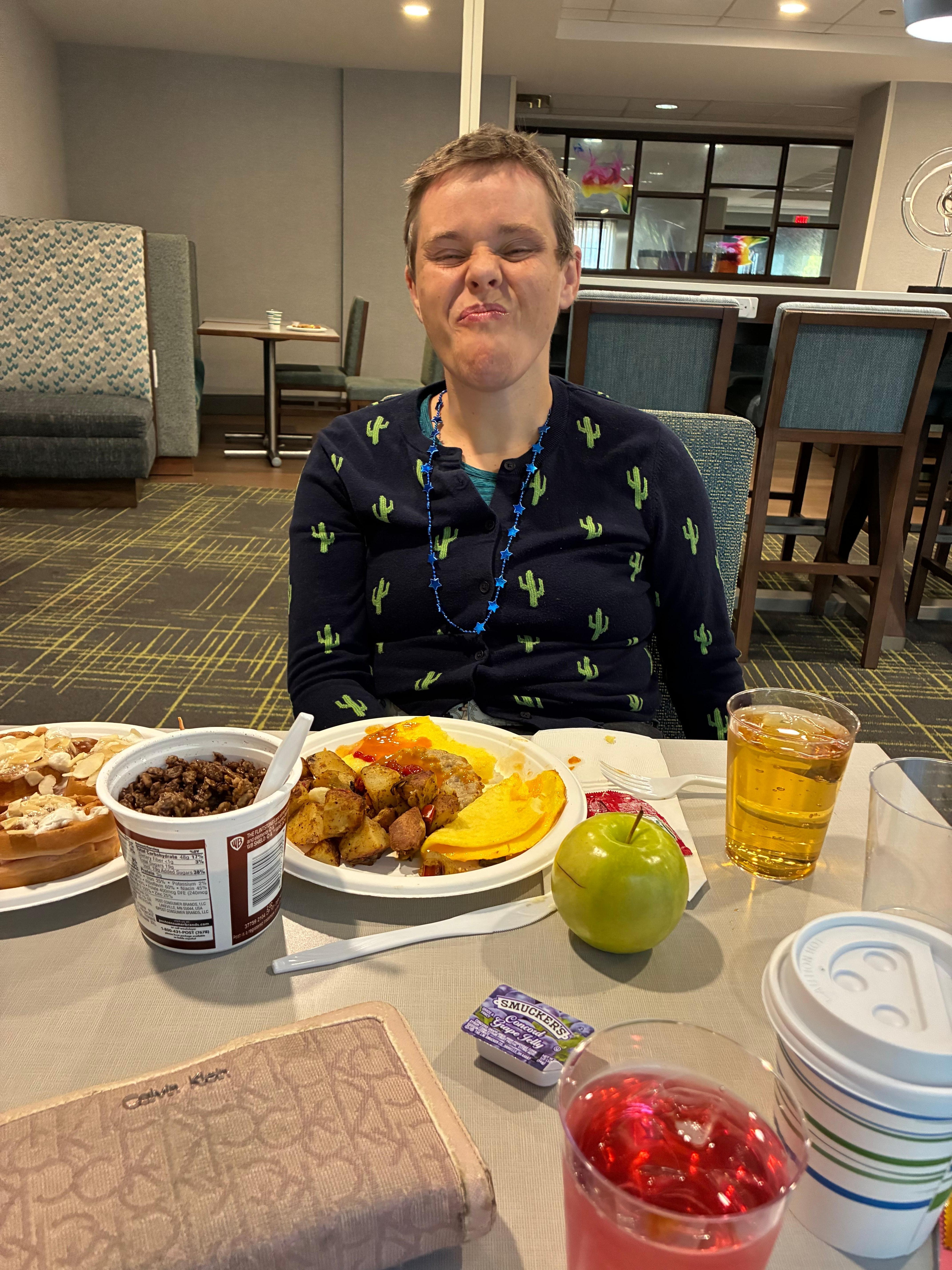 Rachel eating breakfast at Hampton 