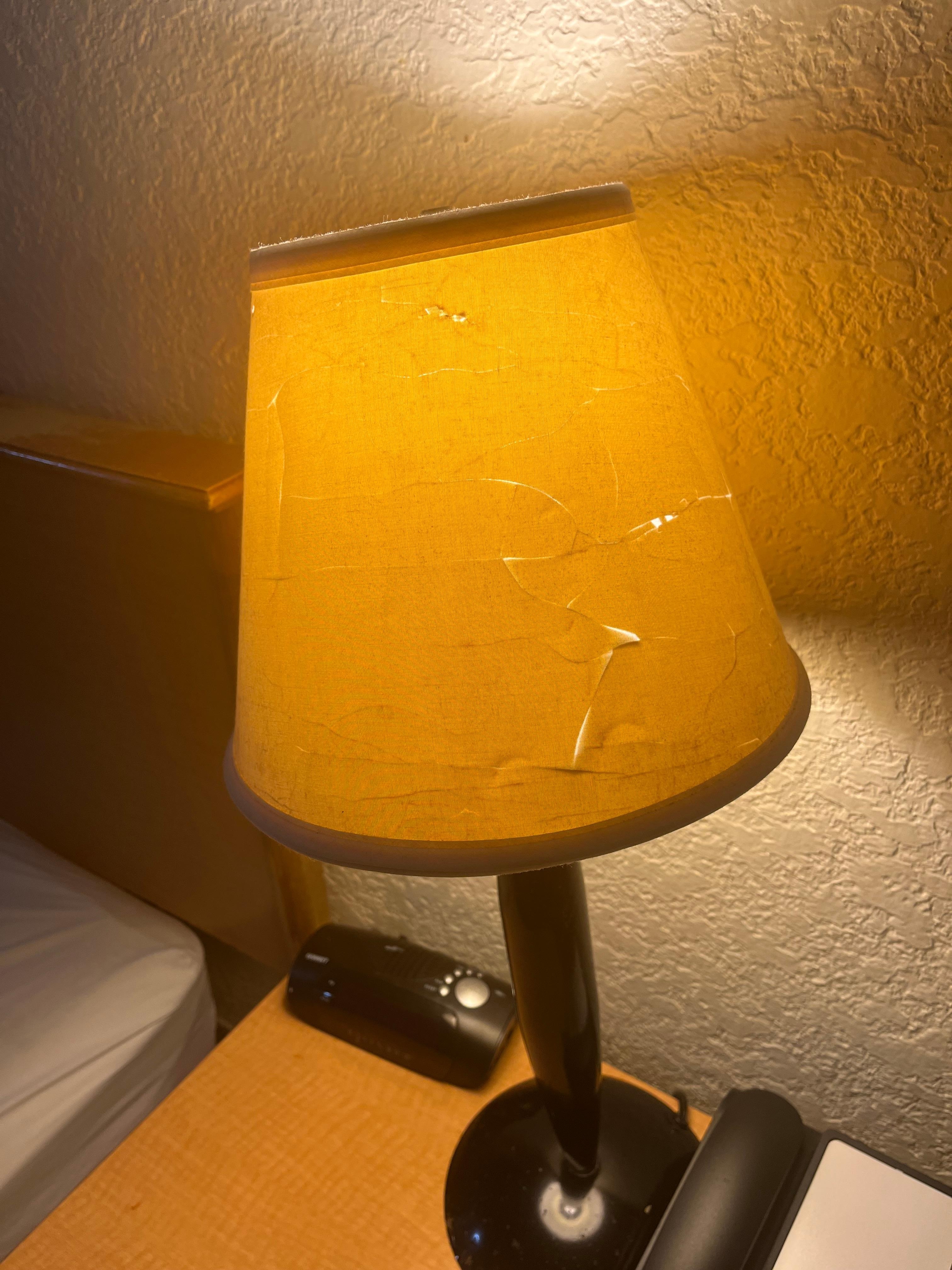 Dirty lamp shade, ripped lopsided