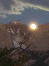 Moon setting on mountain - view from balcony