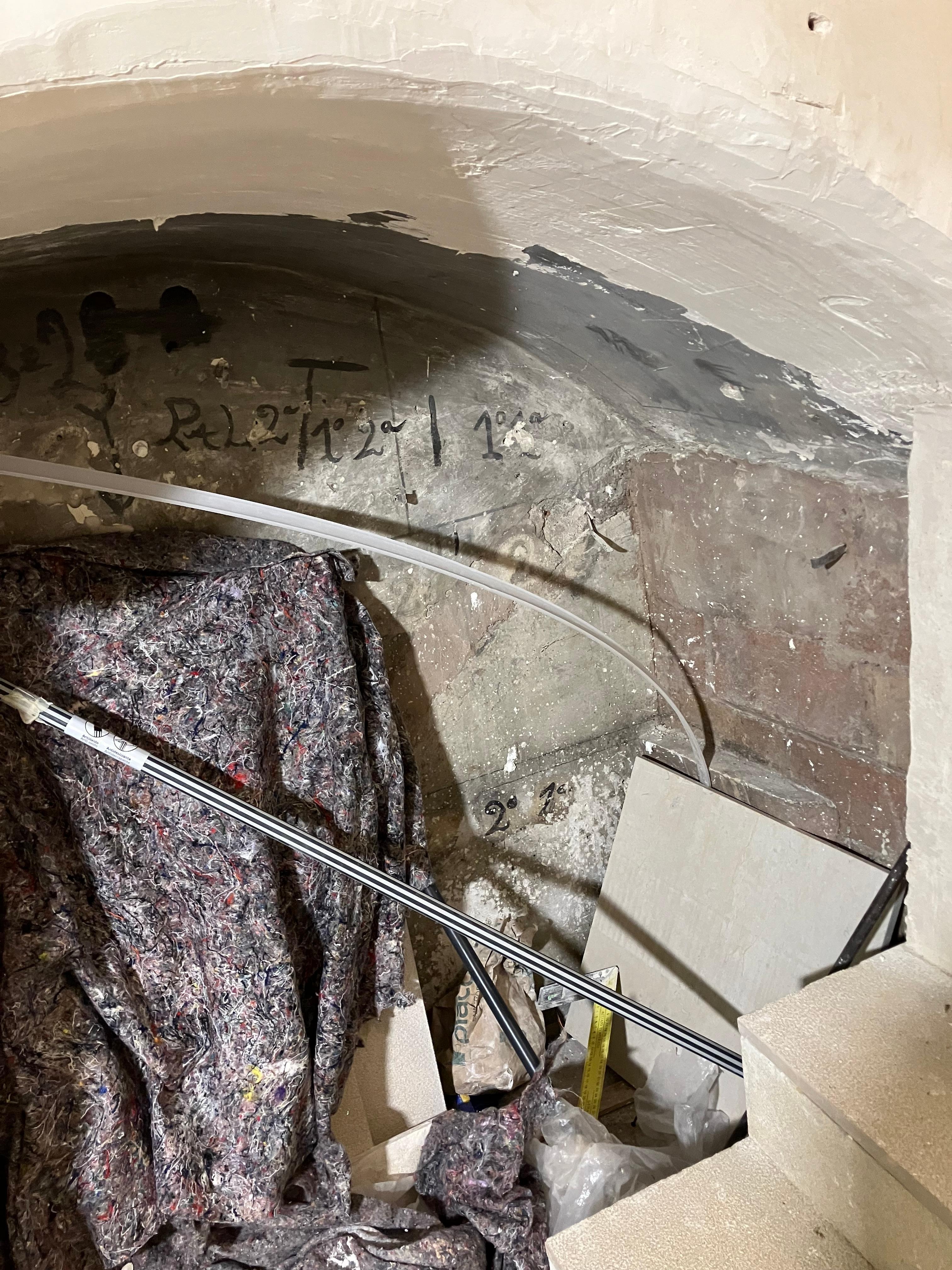 Alcove in stairs. Everything is filthy.