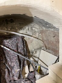 Alcove in stairs. Everything is filthy.