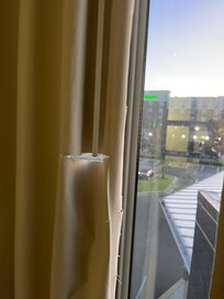 Inside blackened curtains were all tattered and torn.