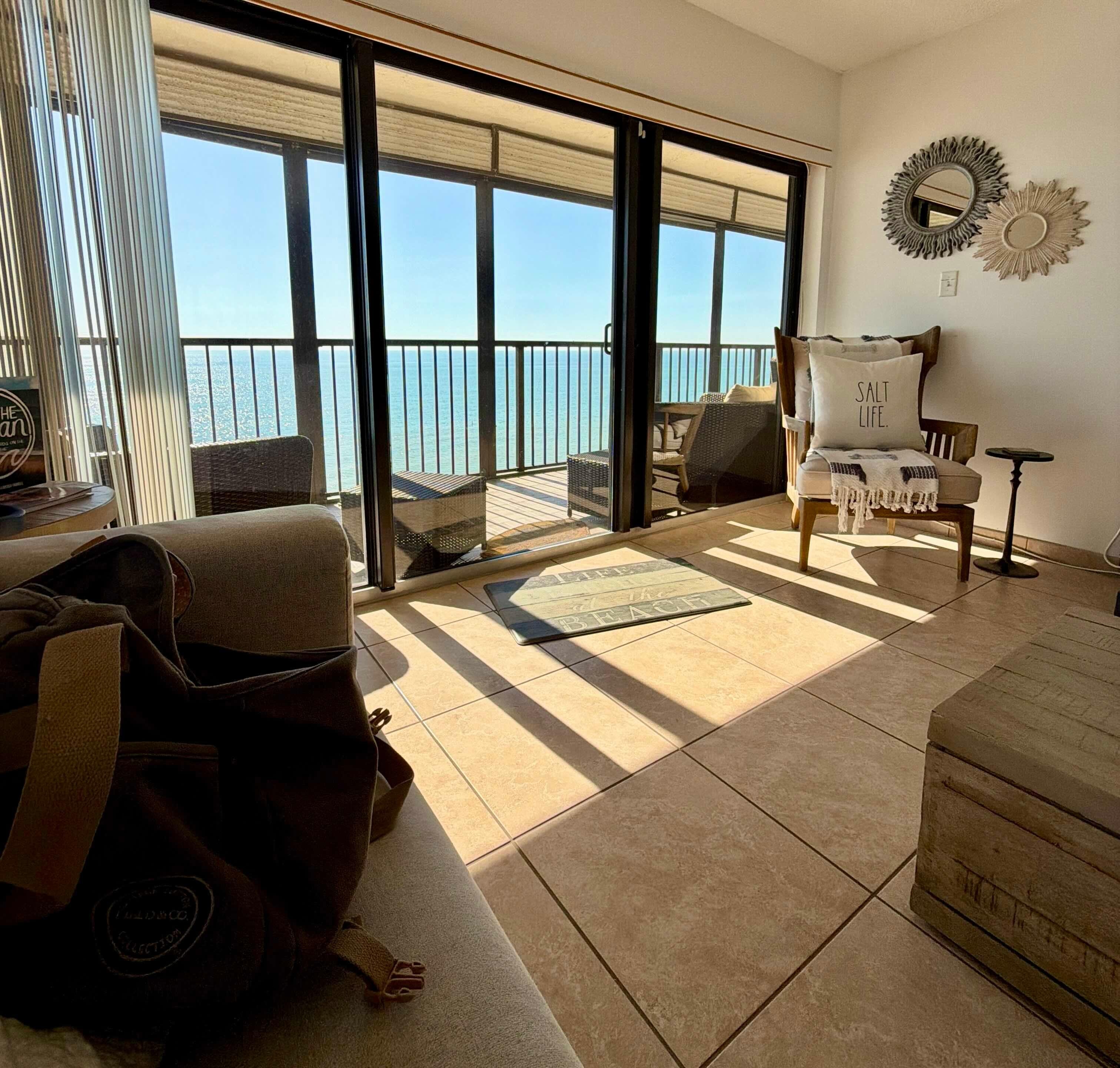 Just a "regular" view of the living room and deck.  The beach and the Gulf are always there!  Very nice!