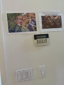 Parking areas outlined were occupied by a charging Tesla and another vehicle.