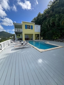 A deck was added on. In older photos, the pool appeared as infinity type; this is not the case. The pool area currently has much more shade than shown in previous photos; pool water is very cold