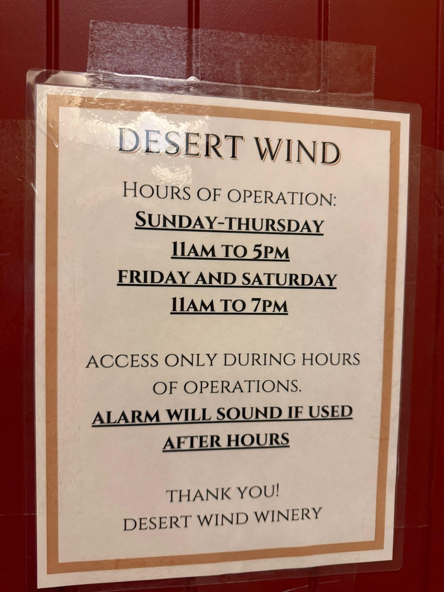 The announcement regarding the hours of operation and the need to use the side door or else the alarms ring. 