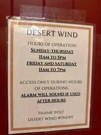 The announcement regarding the hours of operation and the need to use the side door or else the alarms ring.
