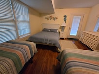 Double with 2 Twins, lower level (garage level) has balcony to rear of the house
