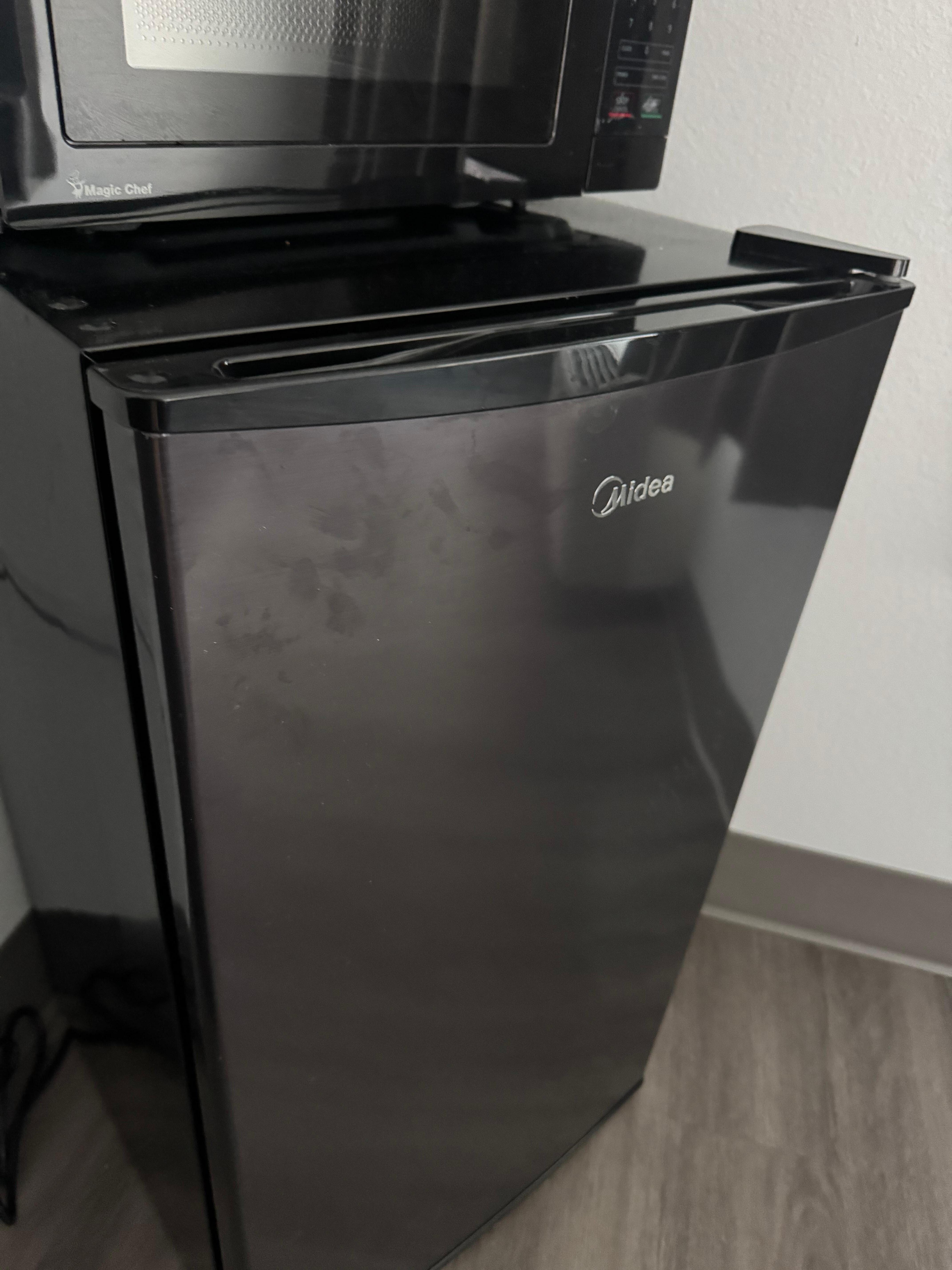 Greasy smudges on fridge door.