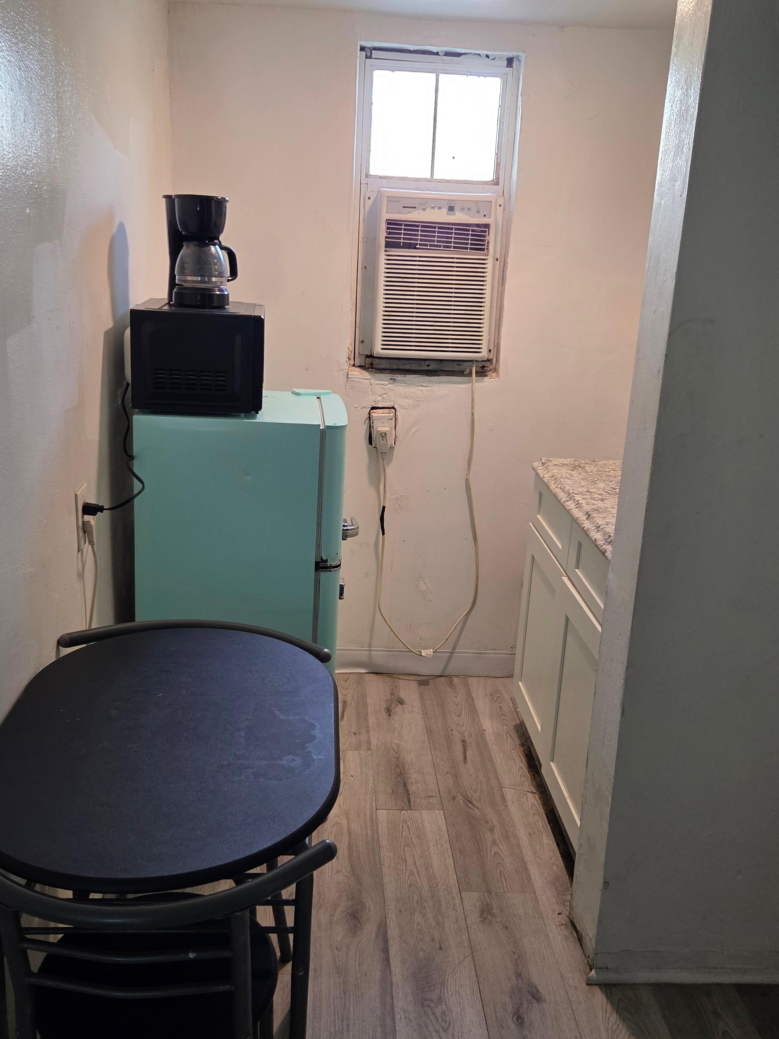 The refrigerator was missing its door handle and it was rusty and dirty 