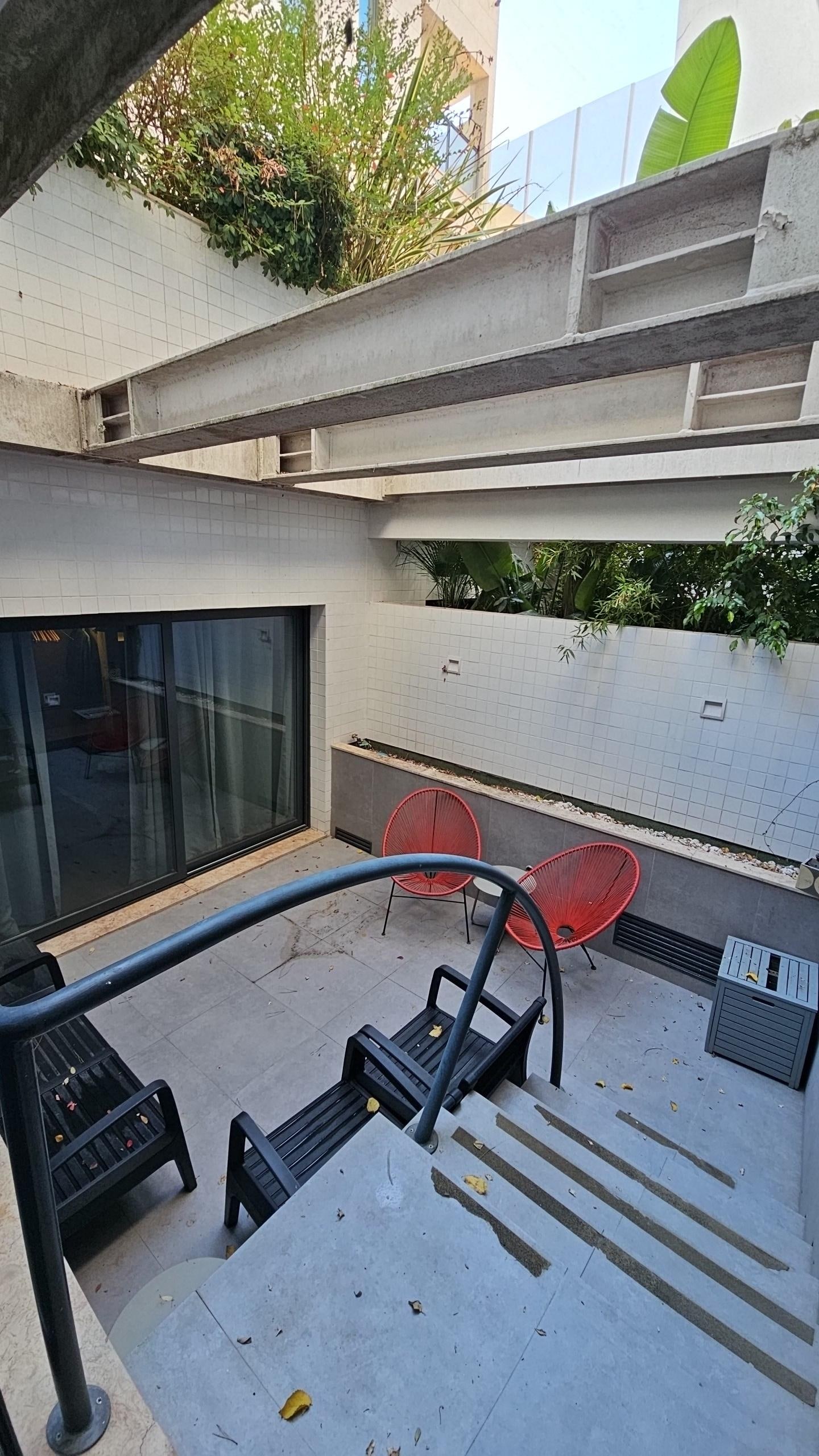 Patio does get spray over from sprinklers above late in evening. 