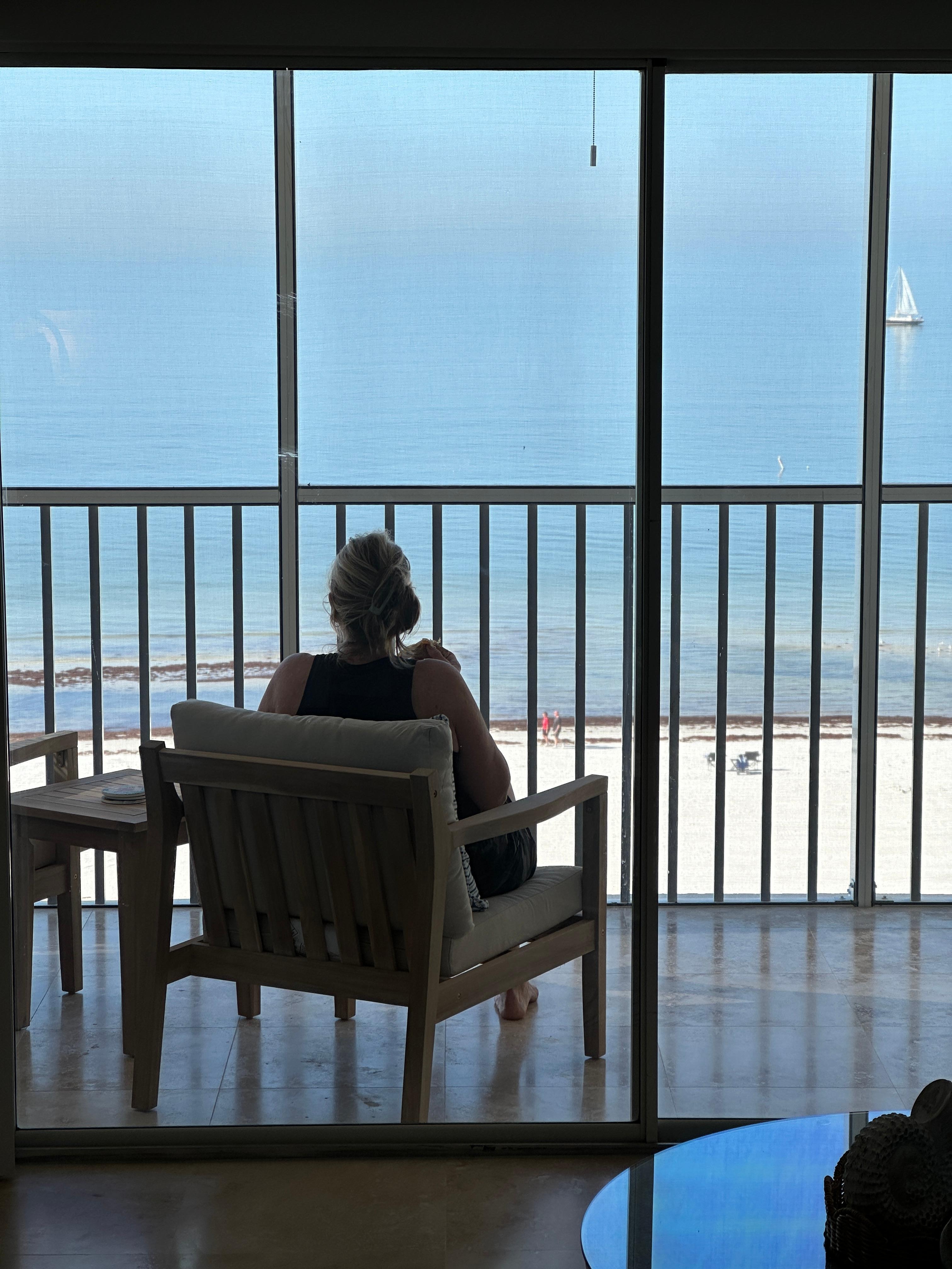 Eating breakfast on patio overlooking the beach and ocean