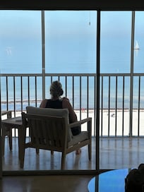 Eating breakfast on patio overlooking the beach and ocean