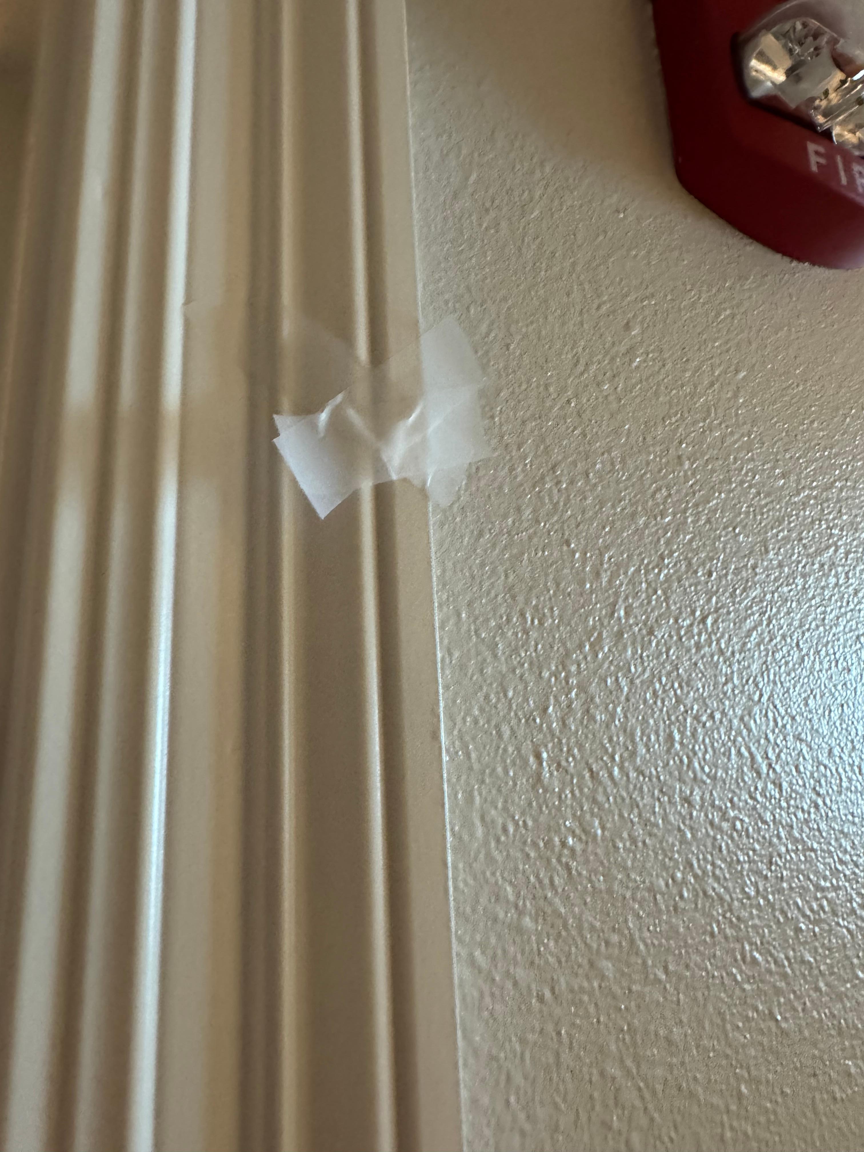 Tape on several walls. Not that big of a deal.