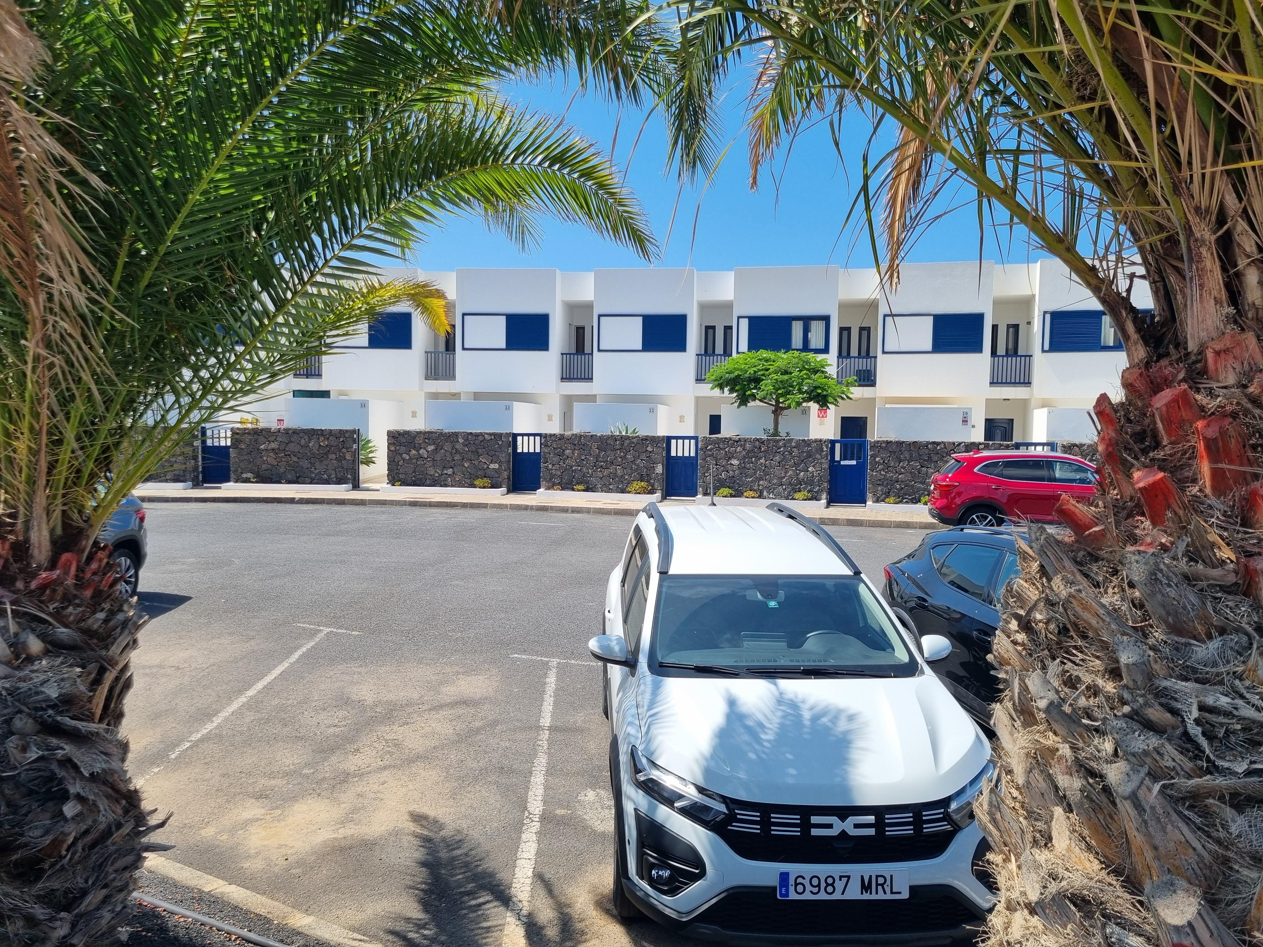 Front view of apartment with adequate parking 