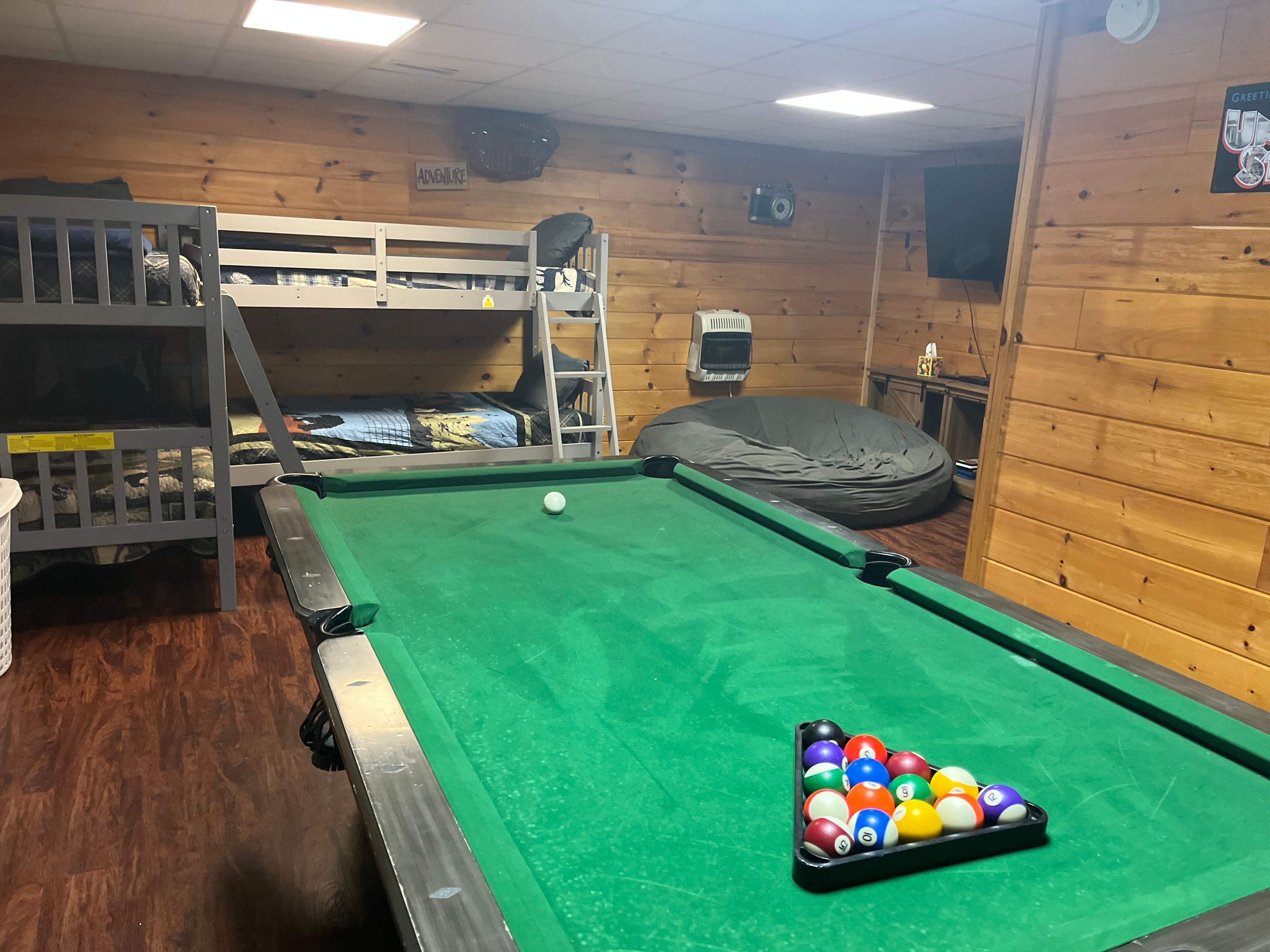 Lower level with a separate bedroom and bathroom walks out to the fire pit and hot tub