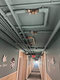 Hallway looks like a passageway aboard a merchant ship.