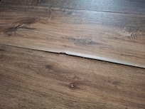 Peeling off fake wood floor