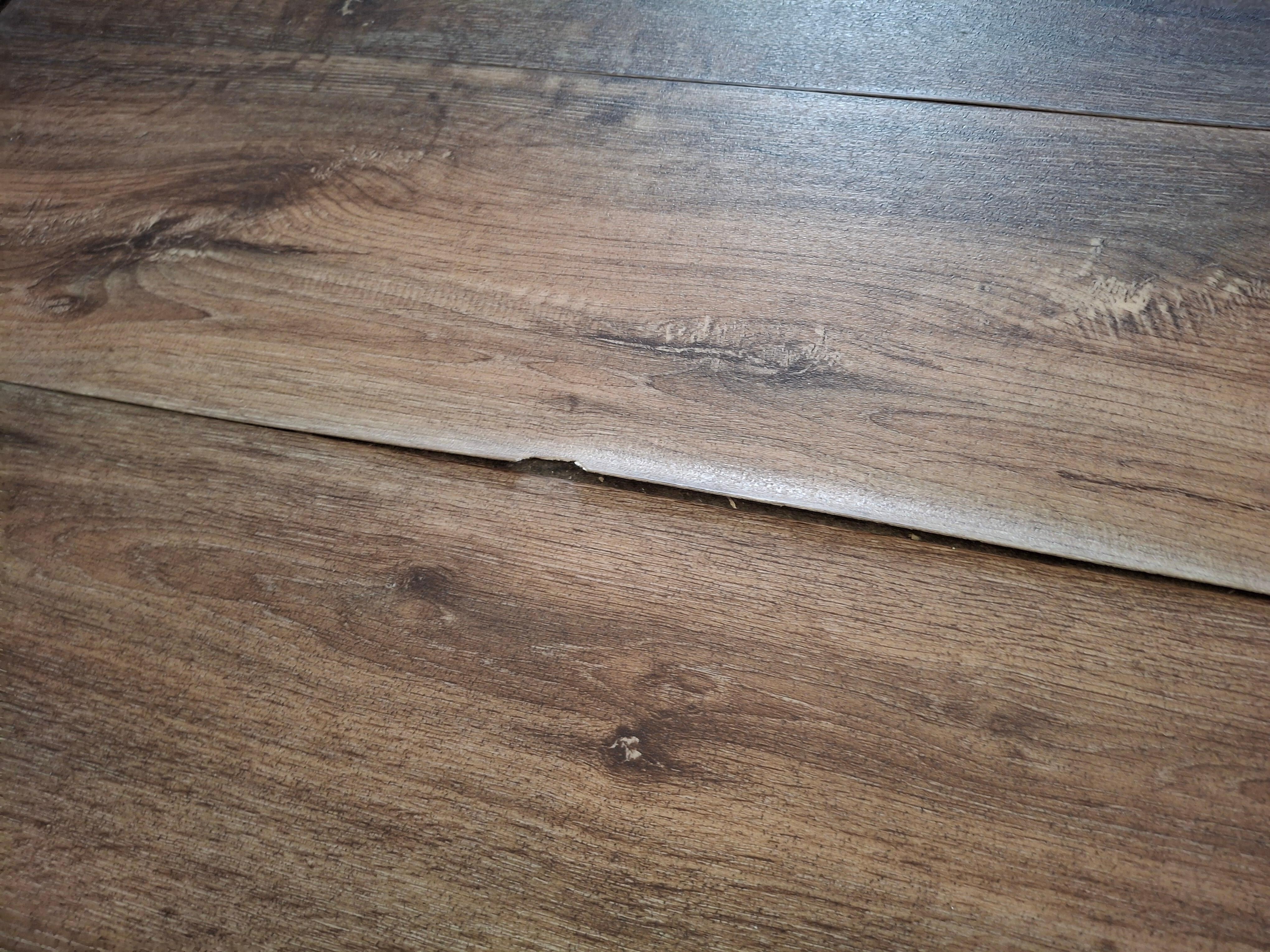 Peeling off fake wood floor