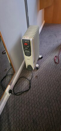Plug in radiator and stain on carpet