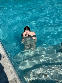 One of the crumbling pool surrounds