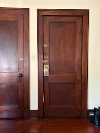 Apartment door leading to stairs has 4 locks
