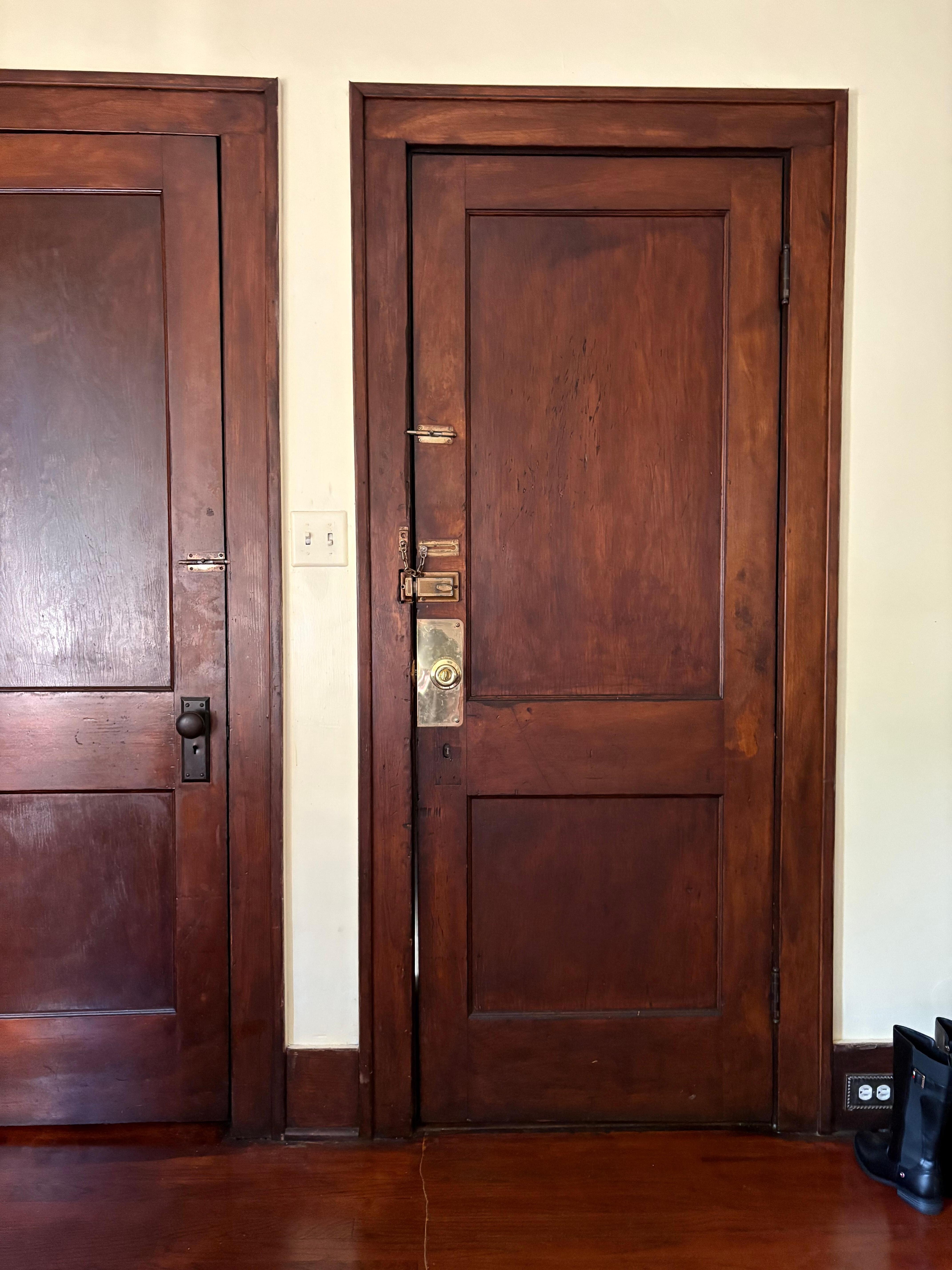 Apartment door leading to stairs has 4 locks