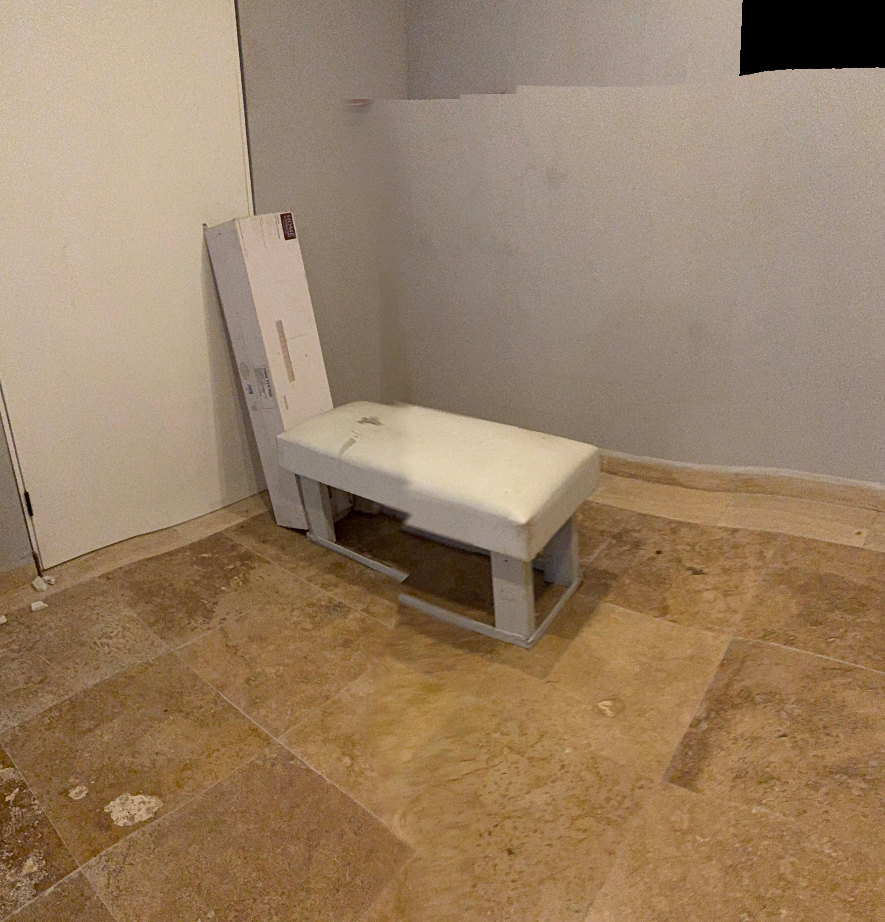 Hallway/stairwell boxes of unfinished furniture and construction materials 