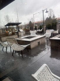 Outside patio with fire pit. It was raining so we didn’t use it, but it looked great!