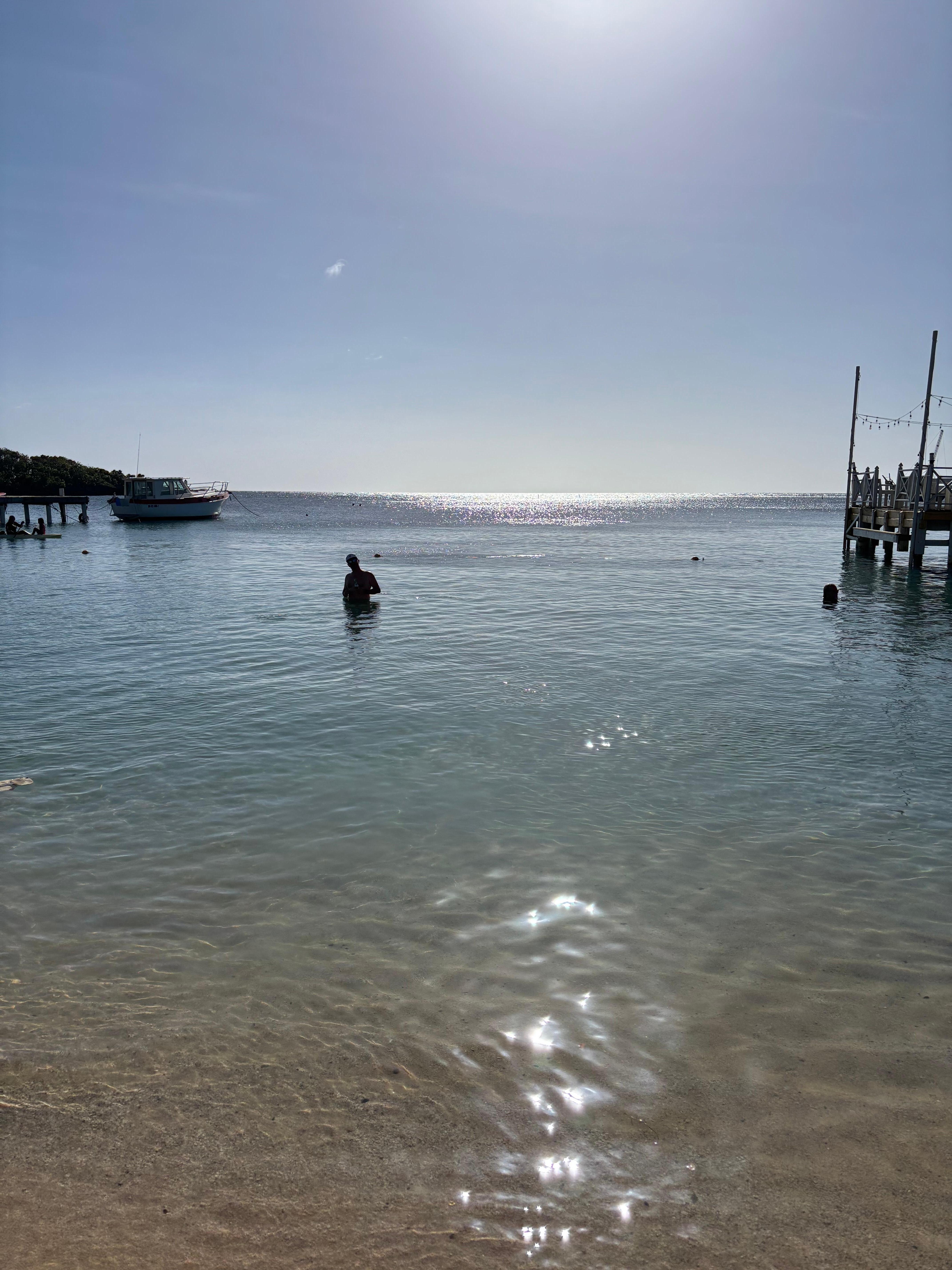 Calm clear water in the bay in front of the Beach House