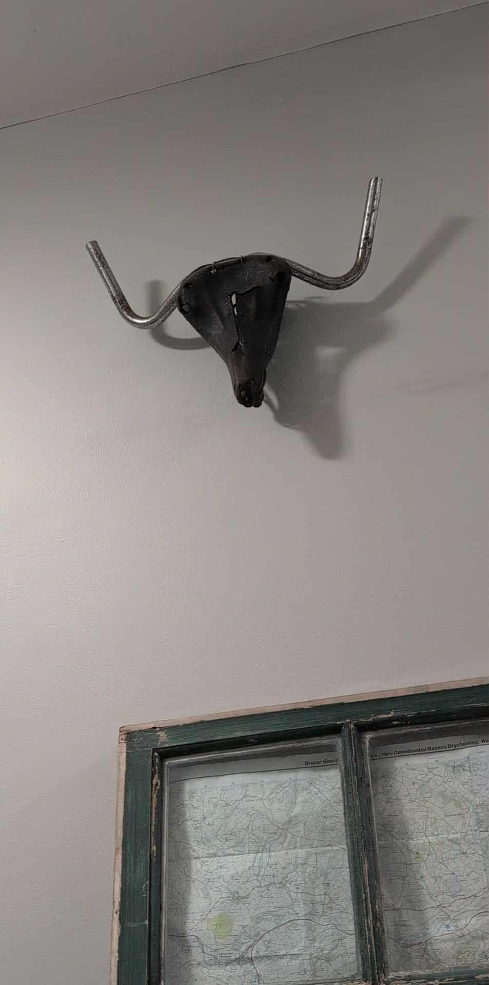 Wall decoration made from bicycle seat and handlebars 