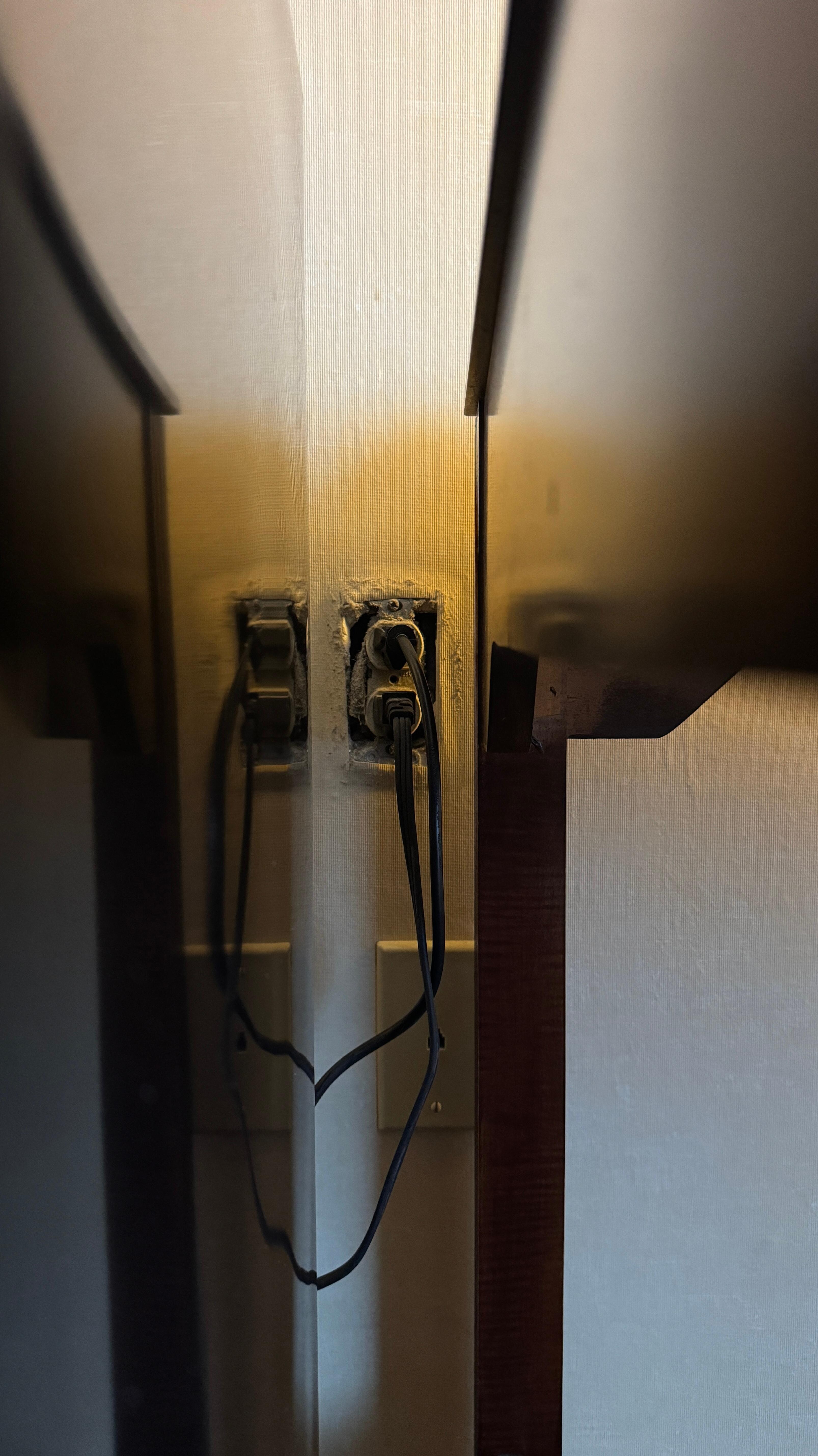 Missing cover plate behind refrigerator, which was not plugged in