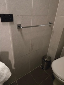 Dirty smear on wall and mould in grout