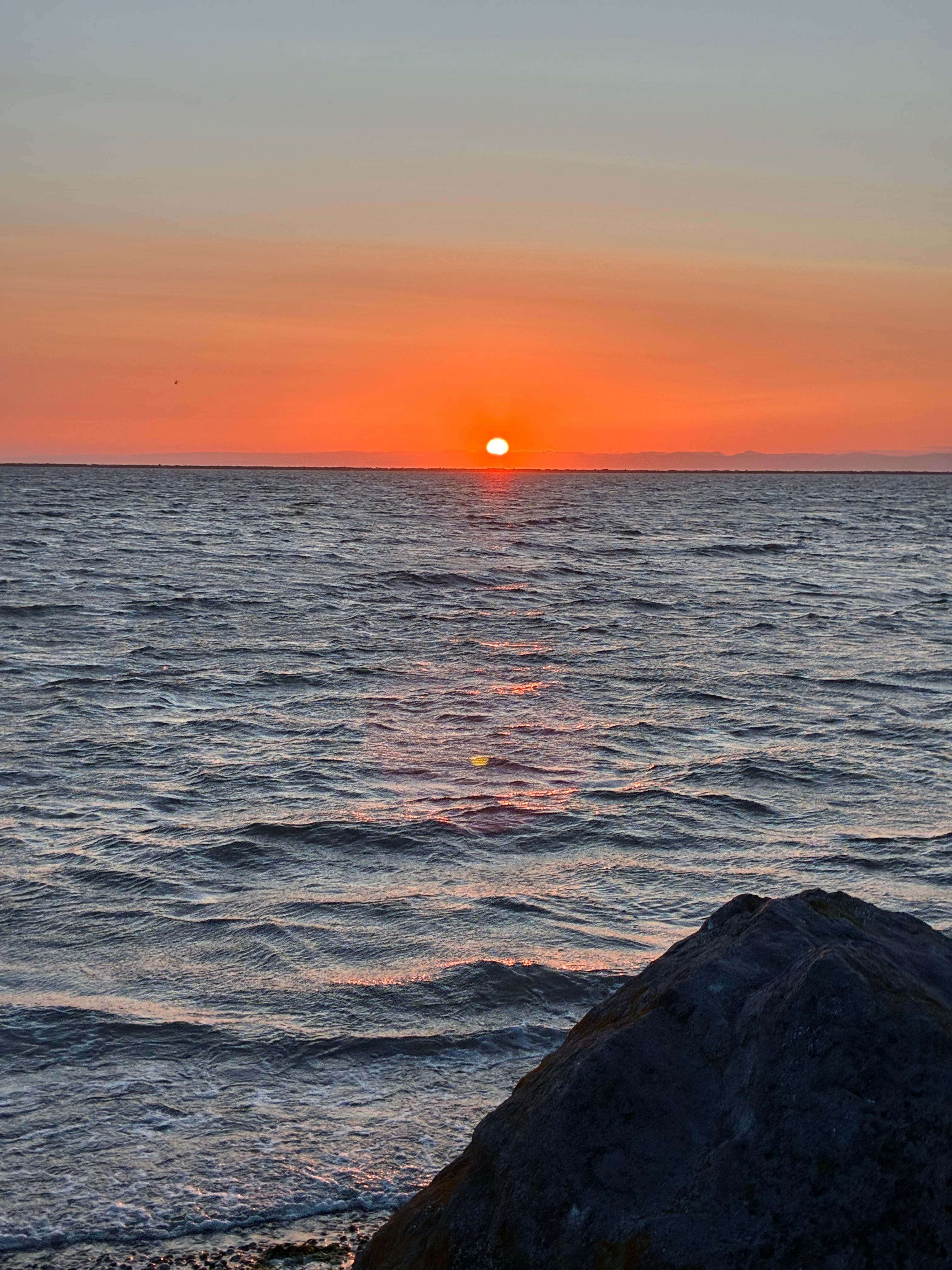Sunset from beach across road 