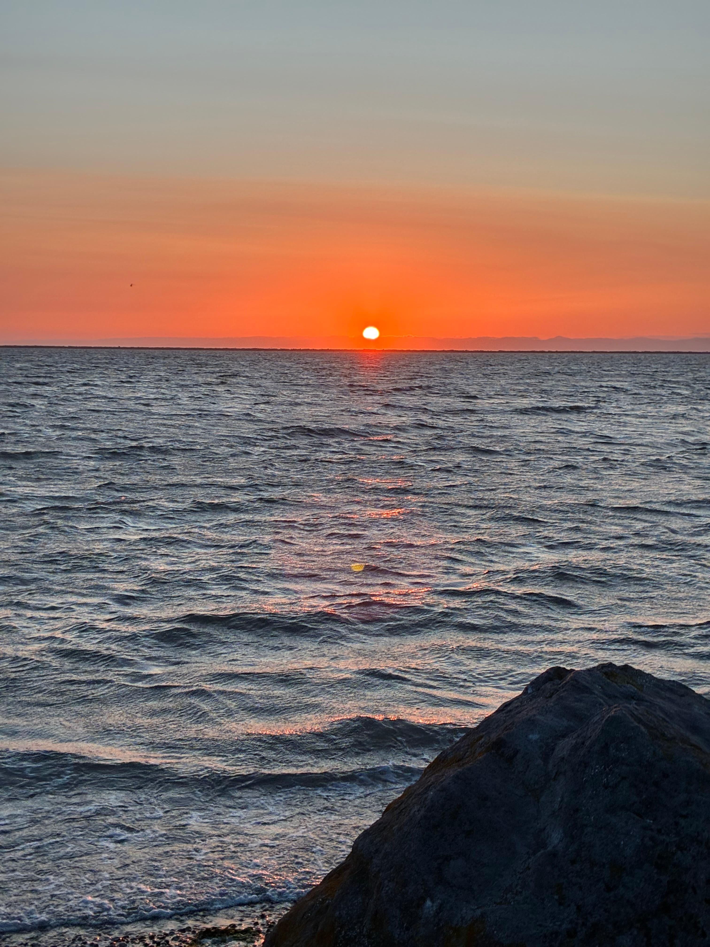 Sunset from beach across road 
