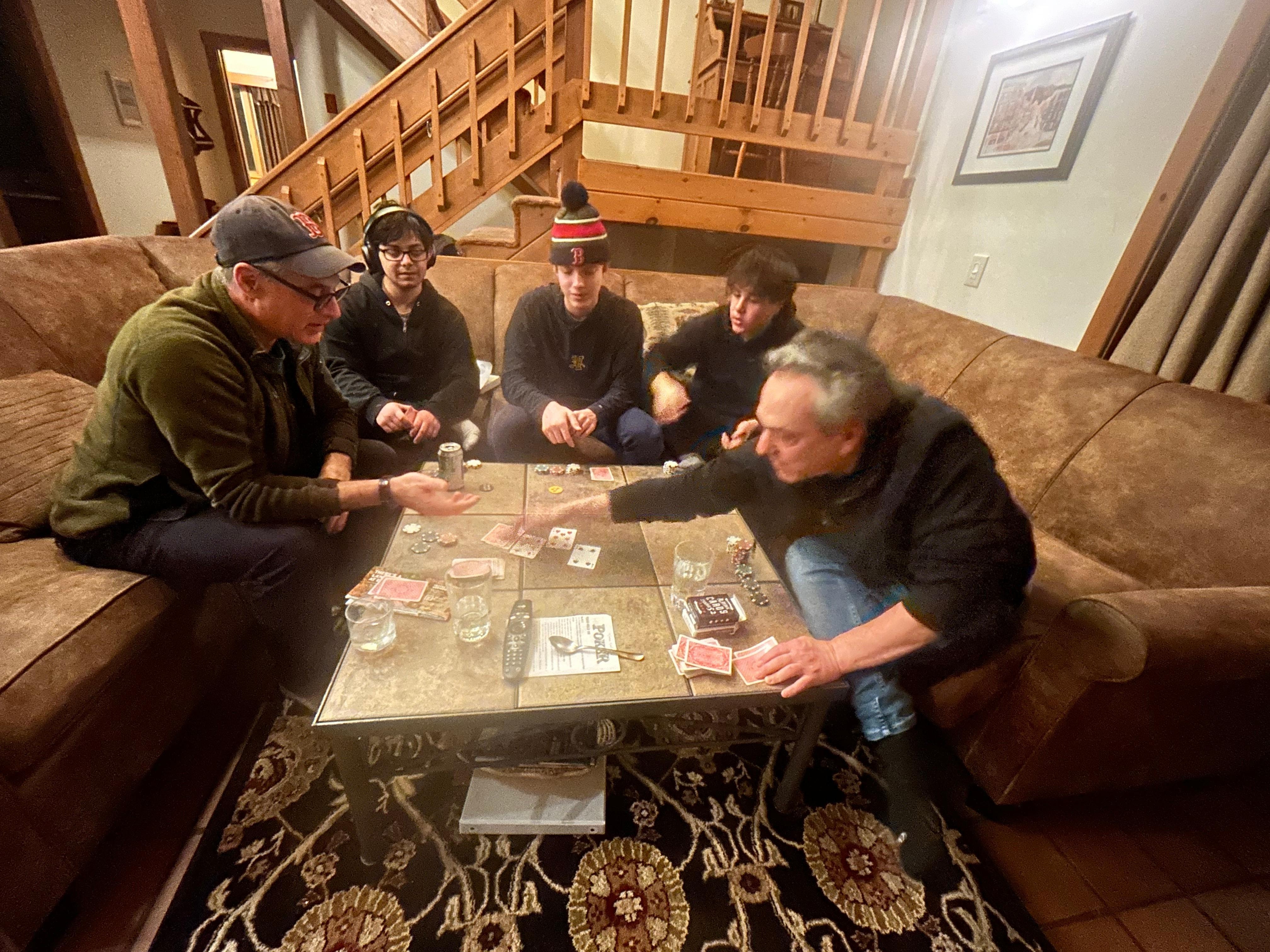 Playing poker by the fire with kids and grandkids