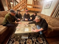Playing poker by the fire with kids and grandkids