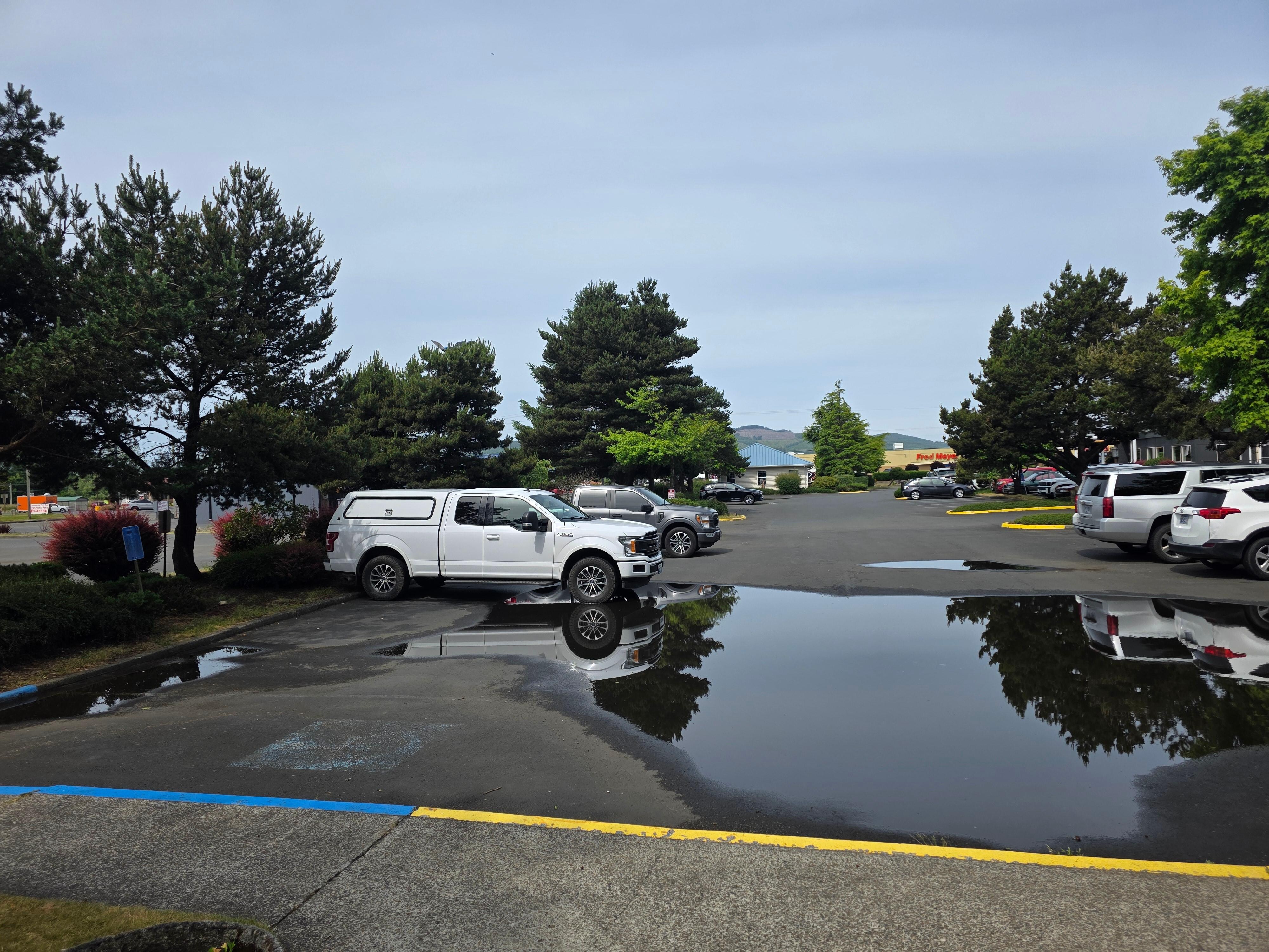 No drainage . Yes it rained as it does on the coast so this should not be where your mobility challenged parking should be