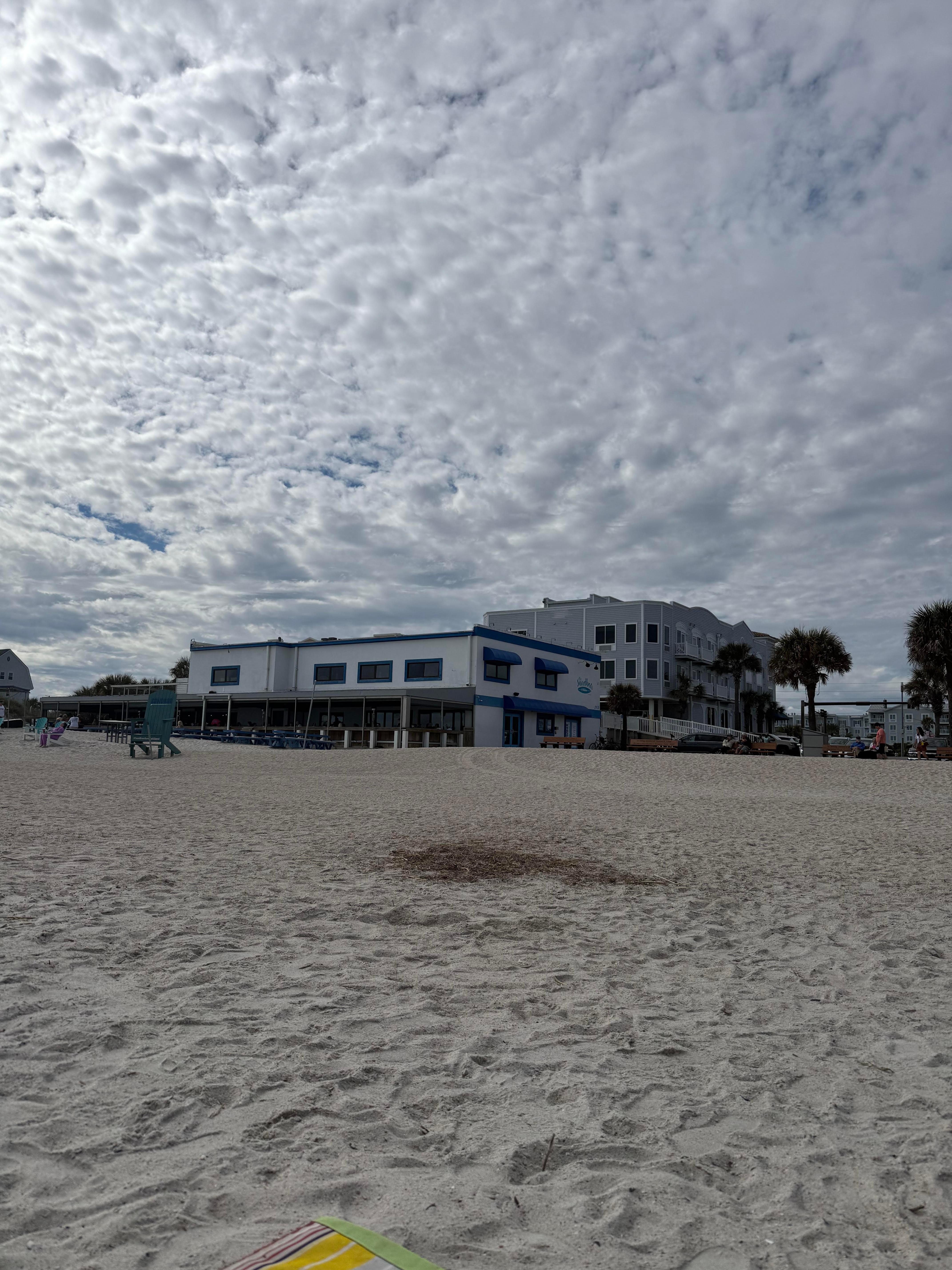 Seaside Amelia Inn behind beach restaurant 
