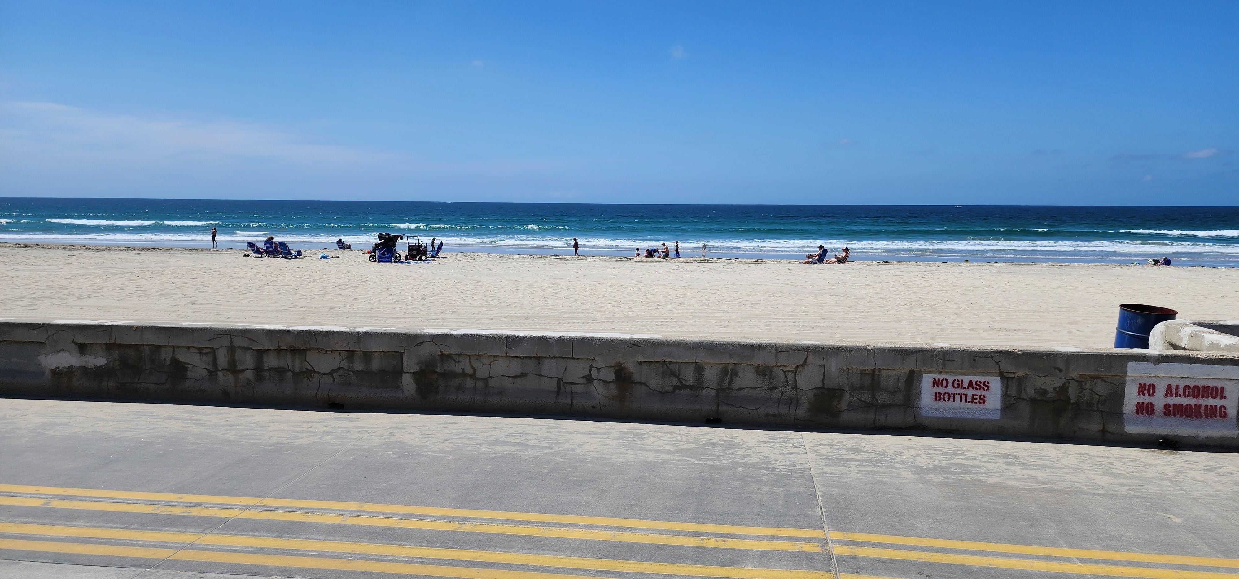 Directly in front of house unit is behind.