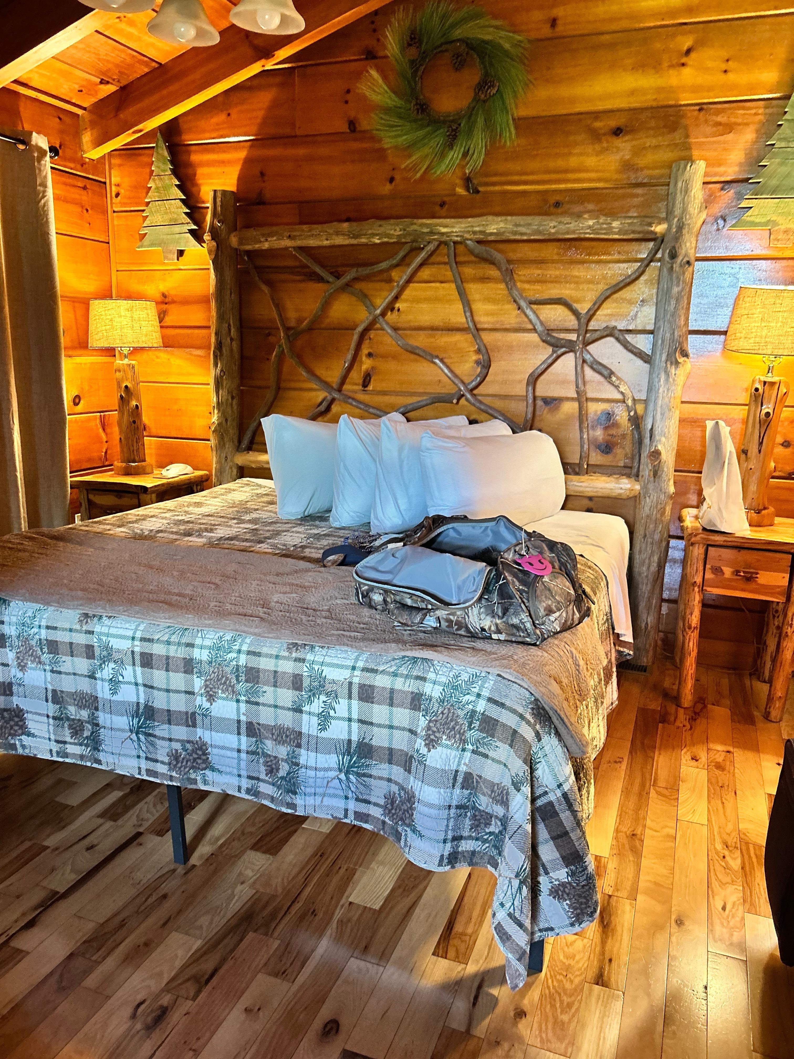 King size bed with log style furnishings. 