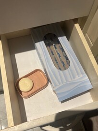 Empty tissue box and used soap in upstairs vanity