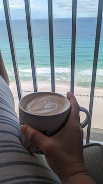 Balcony view with a side of coffee