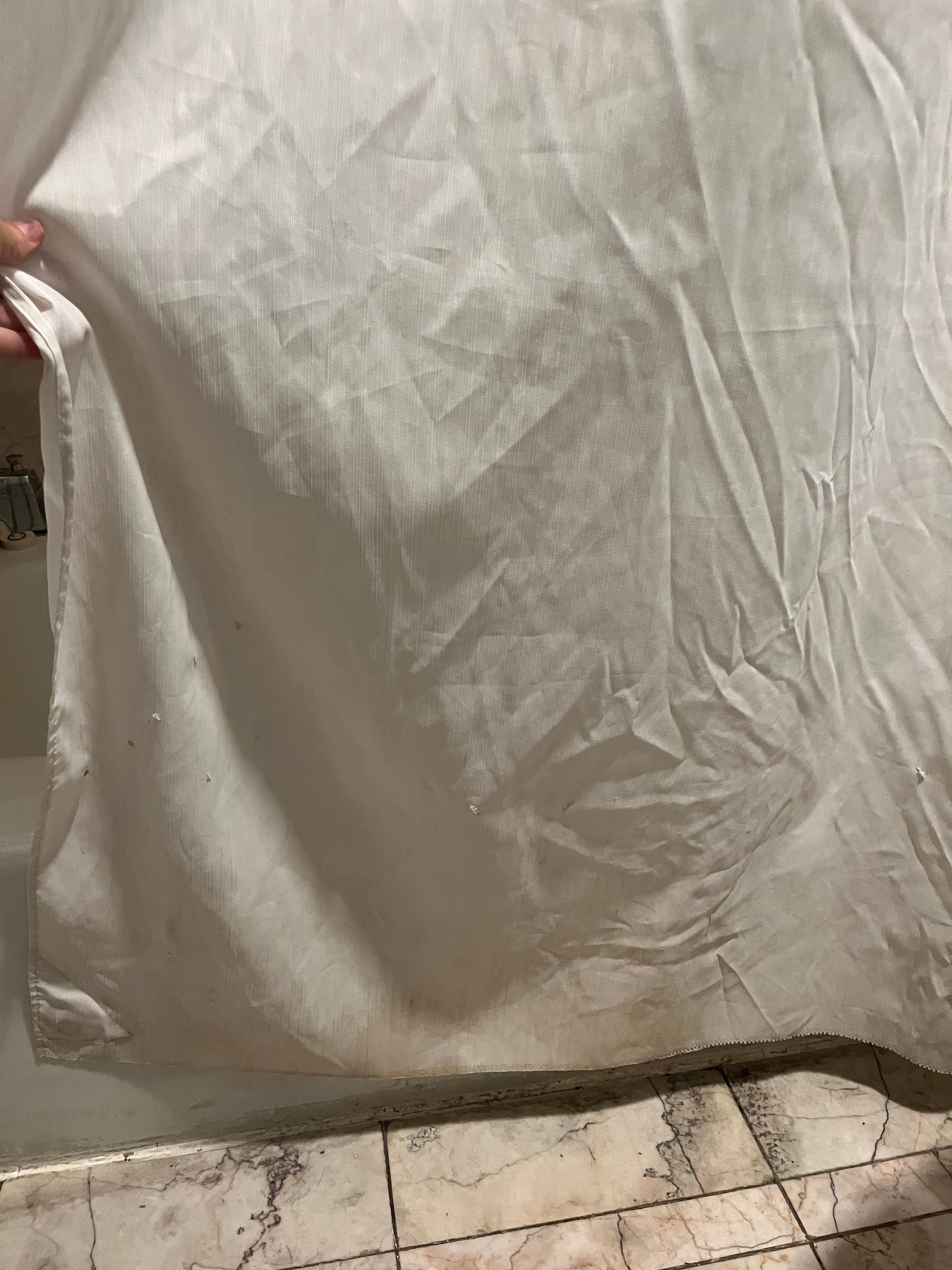 Shower curtain has stains