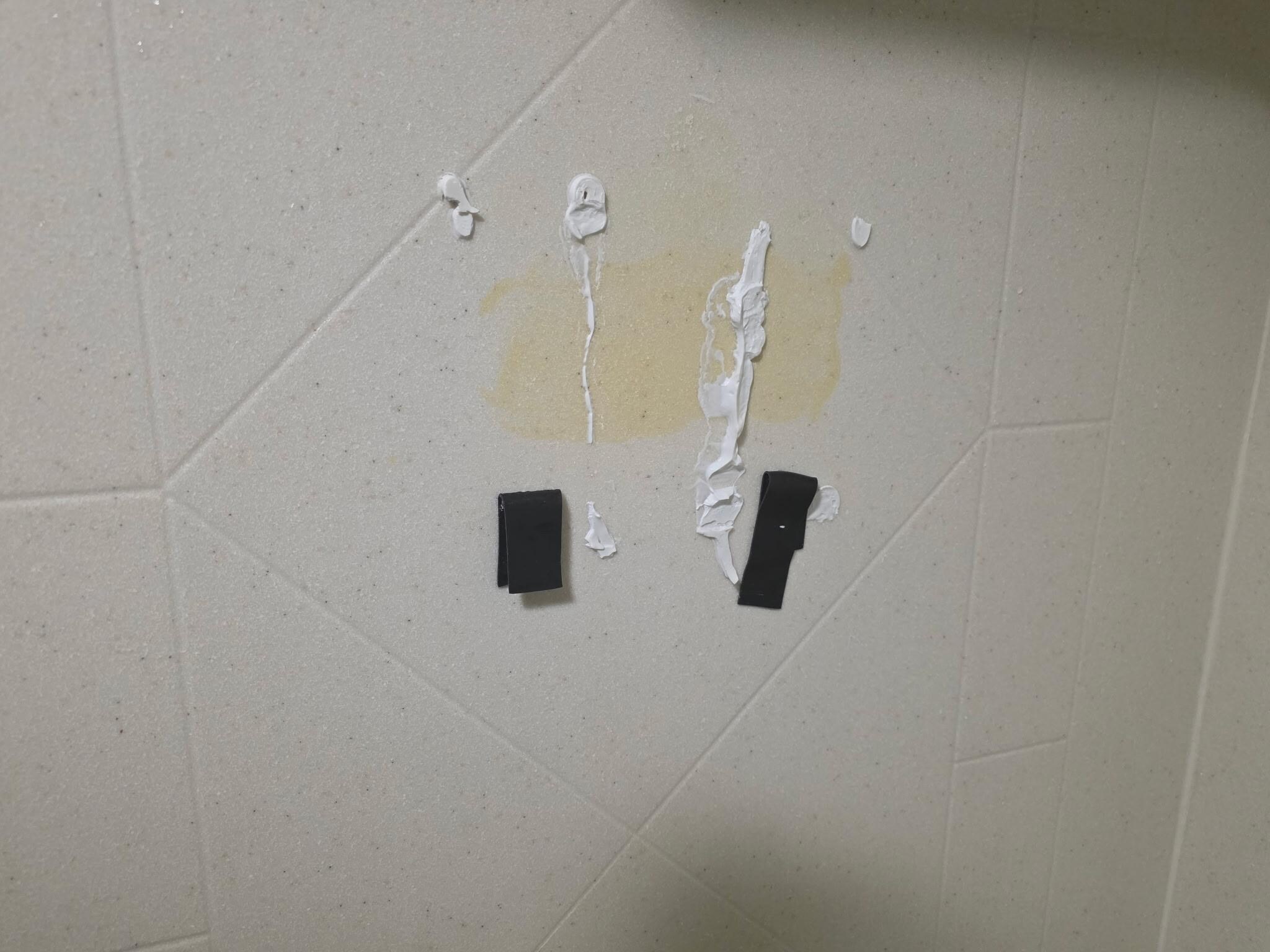 Where the soap dispenser fell and someone tried to glue it