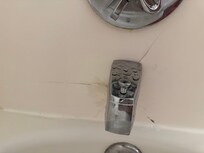 Cracked bath surround in the room bathroom.