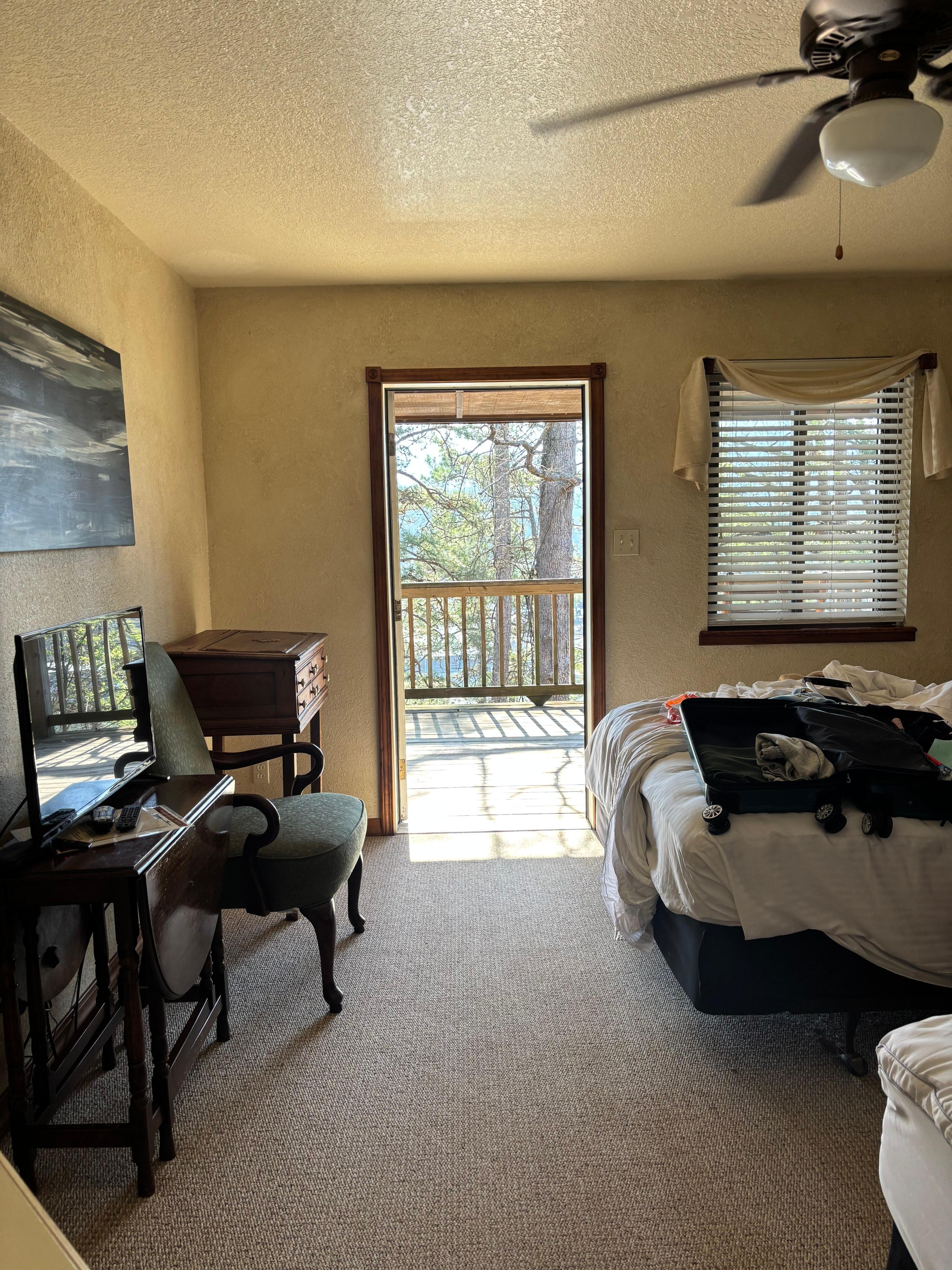 First room down the hallway; all doors open to the deck. 