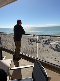 Private beach with beach chairs and umbrellas