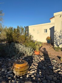 Partial view of house and front landscape